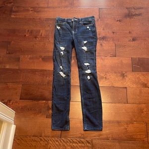 Dark blue distressed skinny jeans